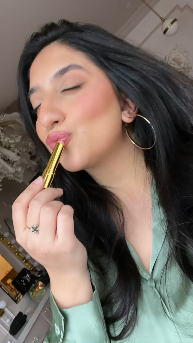 Sahar applying our Coquette Lipslick