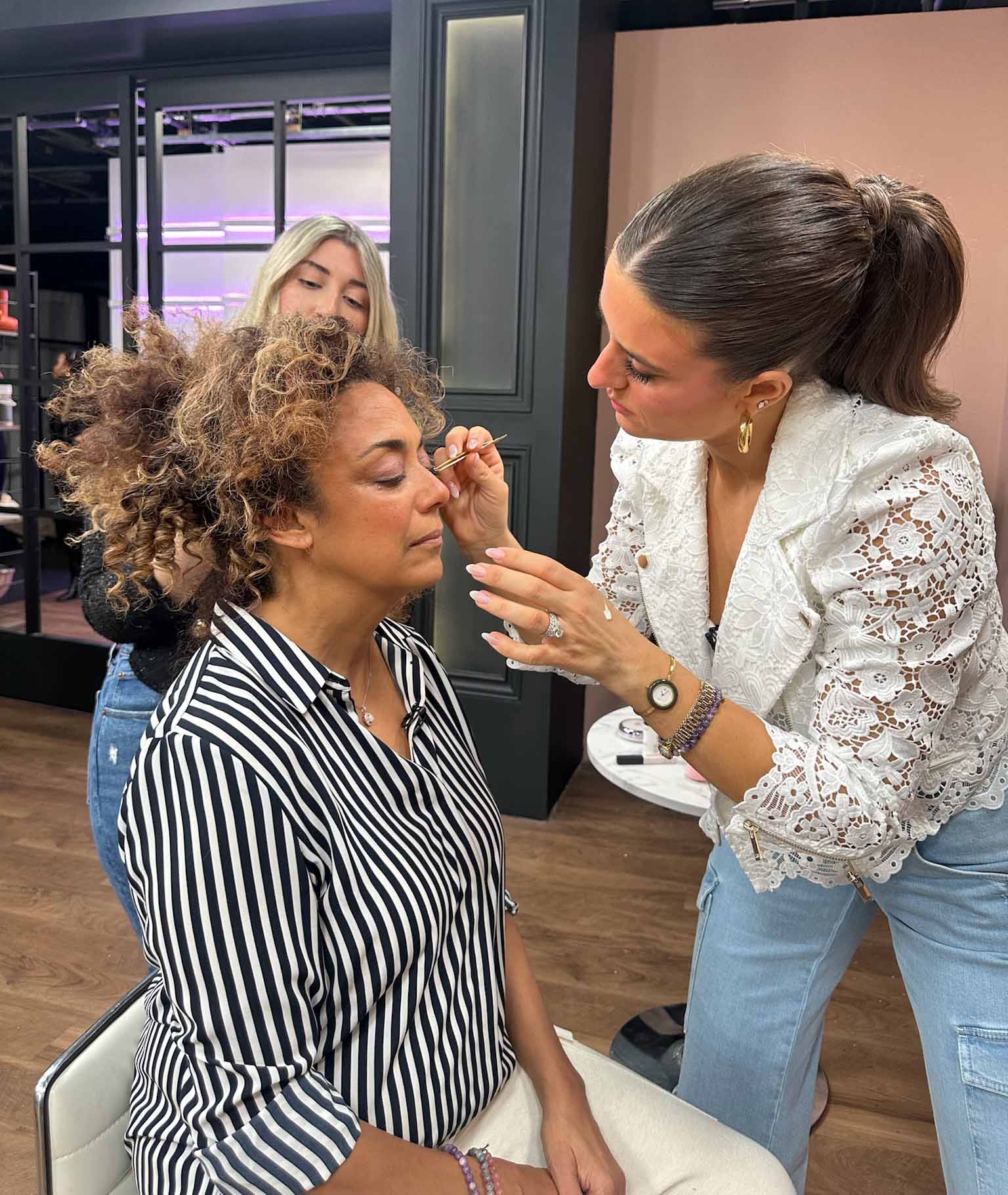 Brittany Gray applying bridal makeup